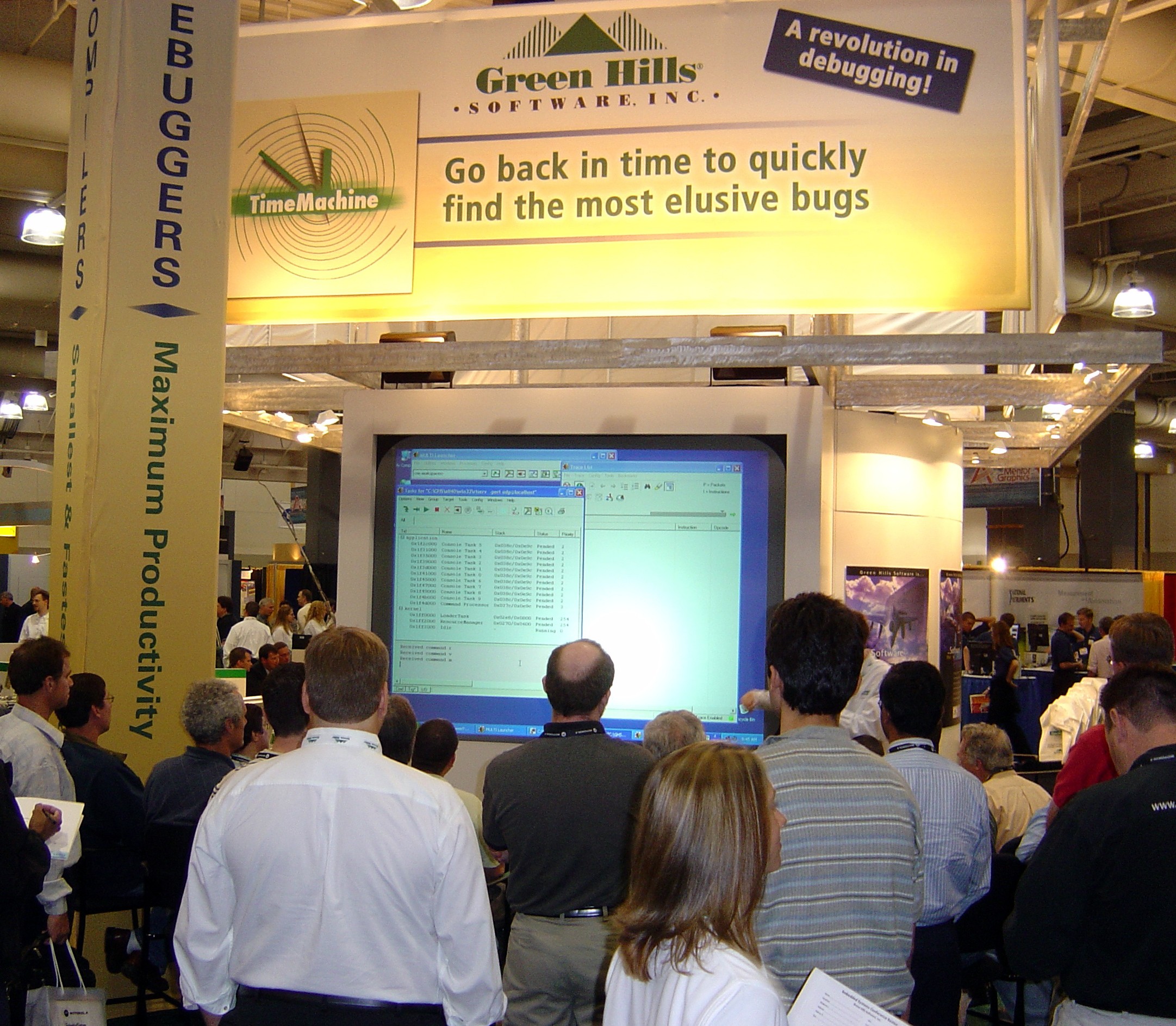Conference attendees watch Green Hills product demonstrations